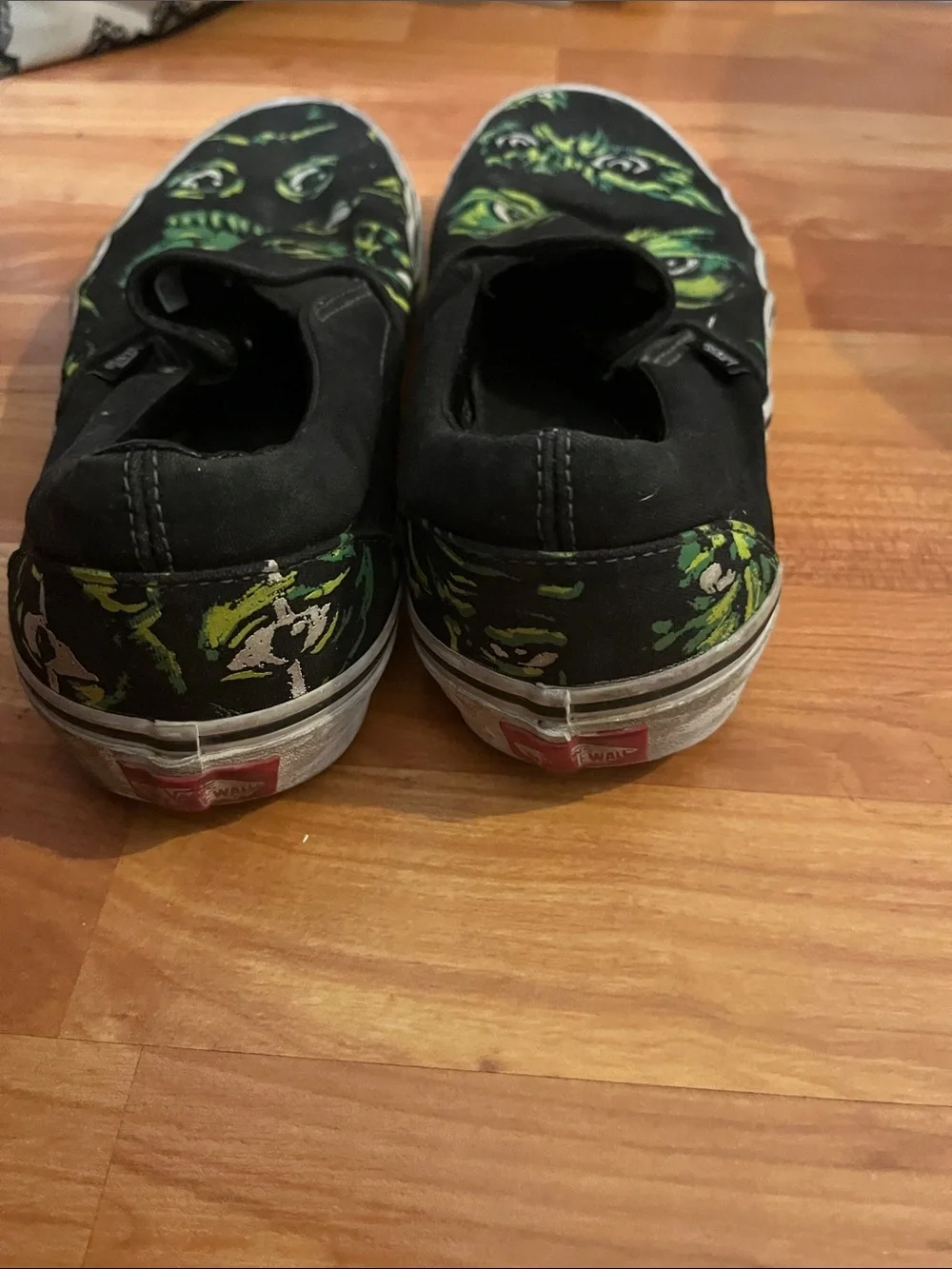 Vans Black Slip-On Sneakers with Eyes in the Dark Size M 10.5 W 12